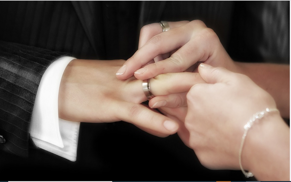 a man receiving a wedding from the spouse